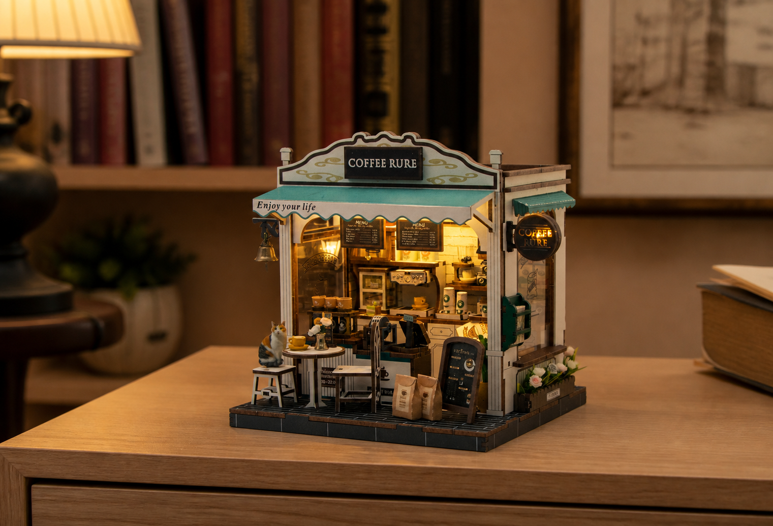 Cafe Rure miniature cafe illuminated on an evening sideboard