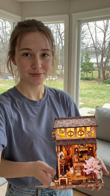 Woman holding a DIY miniature garden kit