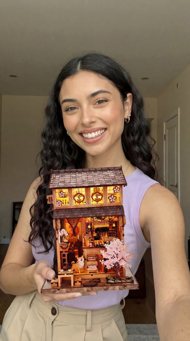 Woman holding a DIY miniature garden kit