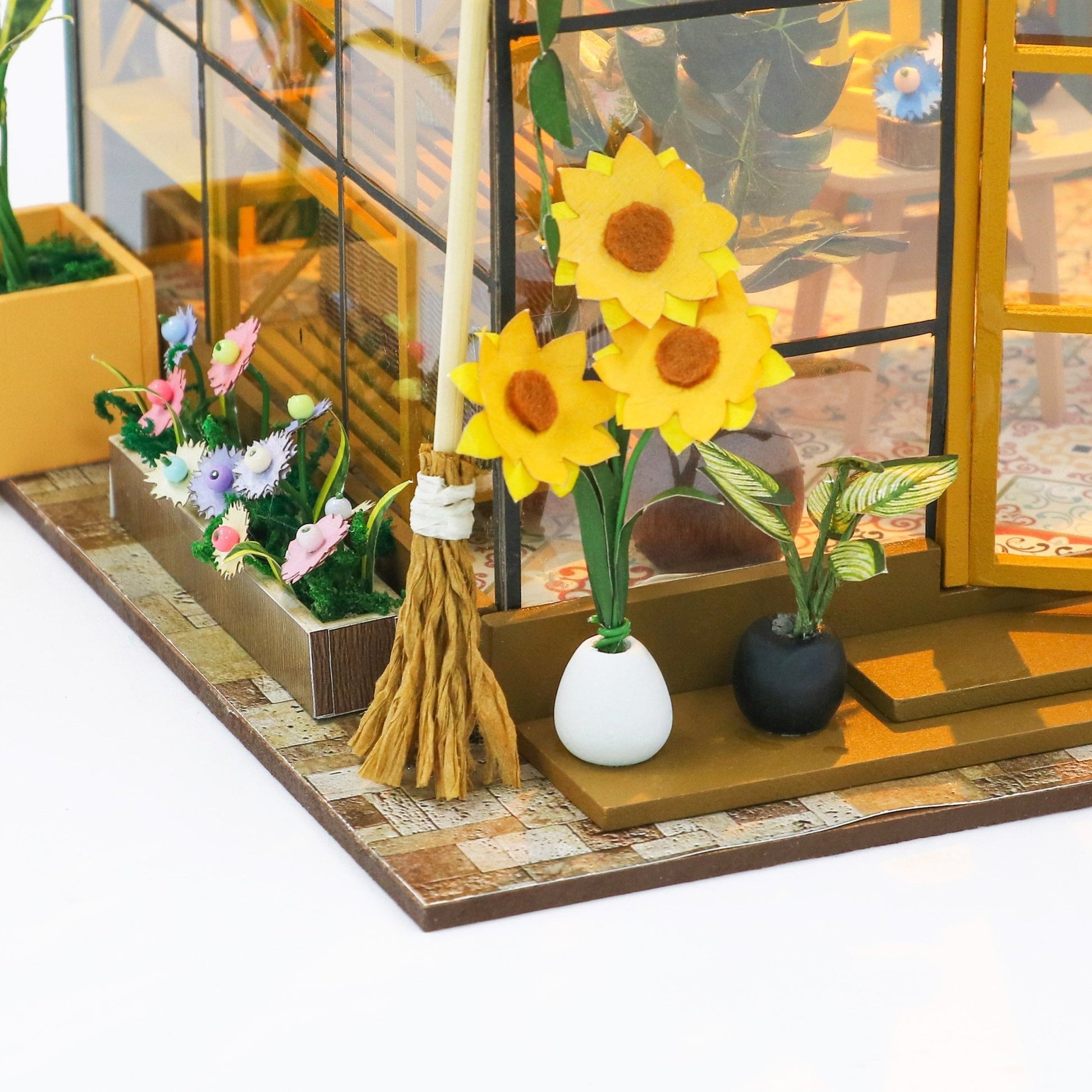 Sunshine Greenhouse DIY miniature house kit monstera and floral close-up